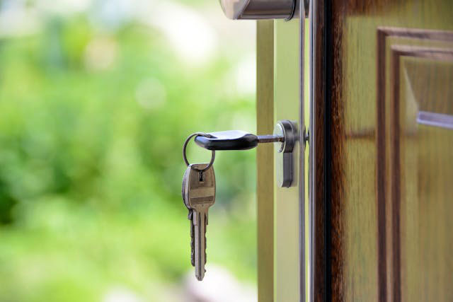 a house key in a door lock