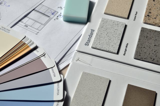 a bunch of paint and tile samples from property renovations