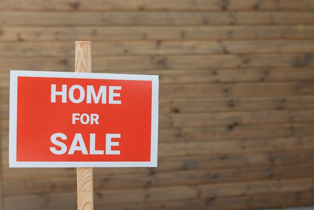 a home for sale sign